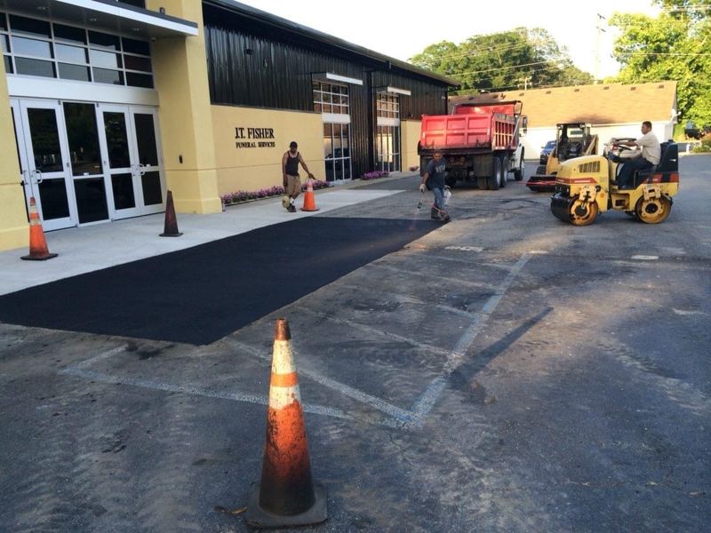 Circular driveway with concrete curbing colonial home Virginia