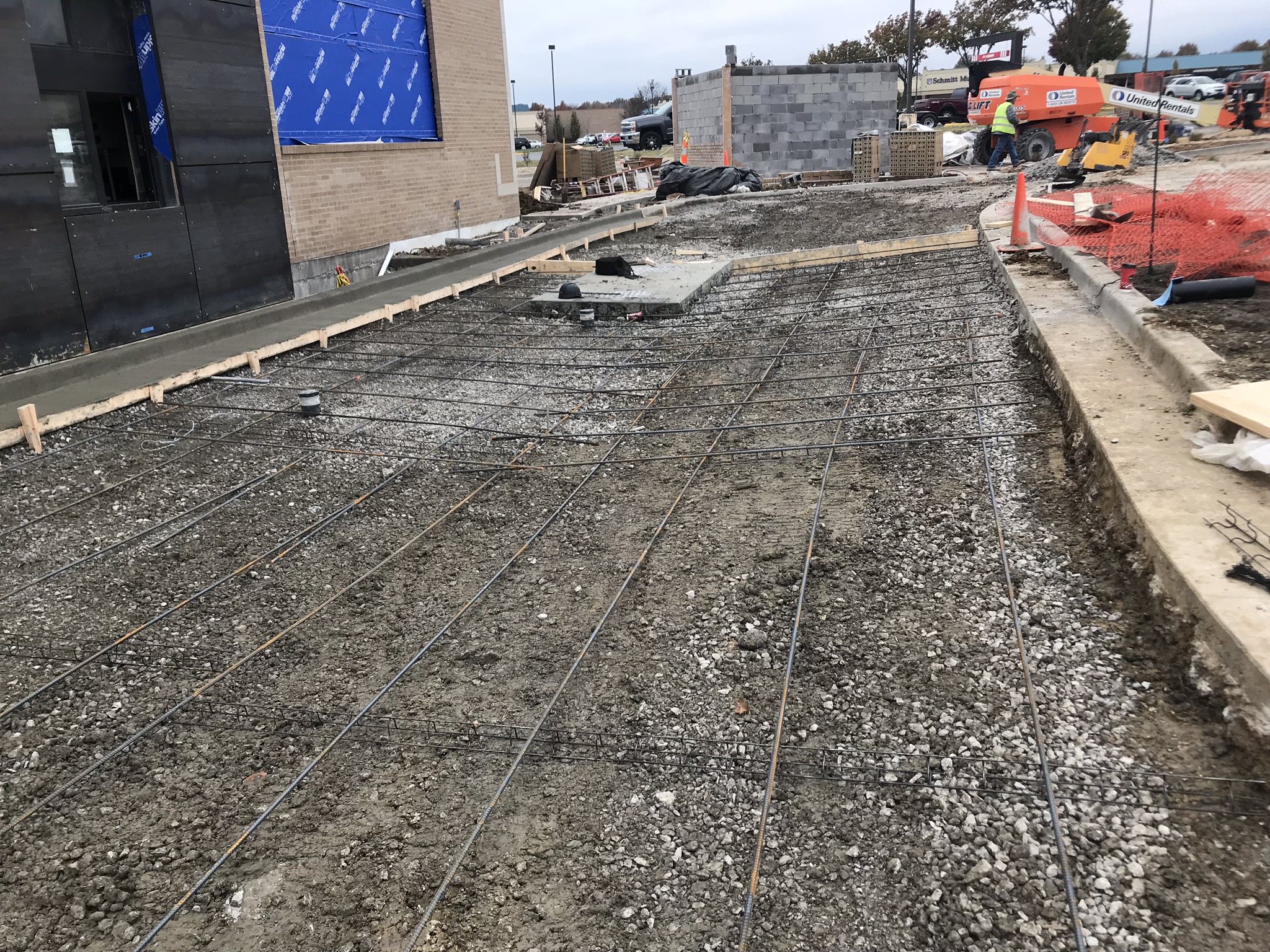 Commercial parking lot paving with CAT roller in Williamsburg Virginia
