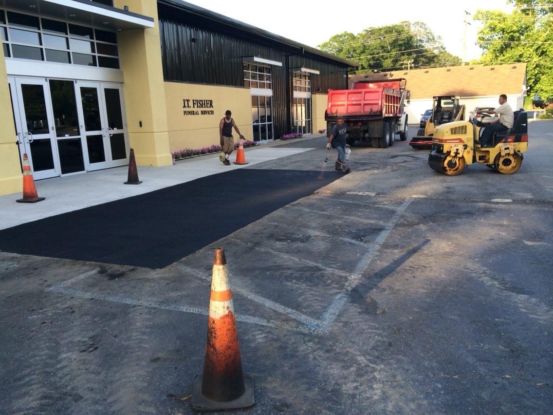 Circular driveway with concrete curbing colonial home Virginia